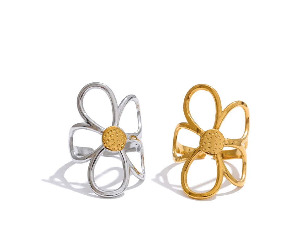 Fashion shot of finger ring finger stacked with the flower ring as focal