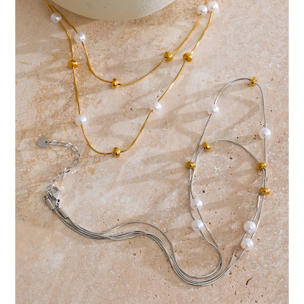 Close up of pearl on necklace showing delicate placement