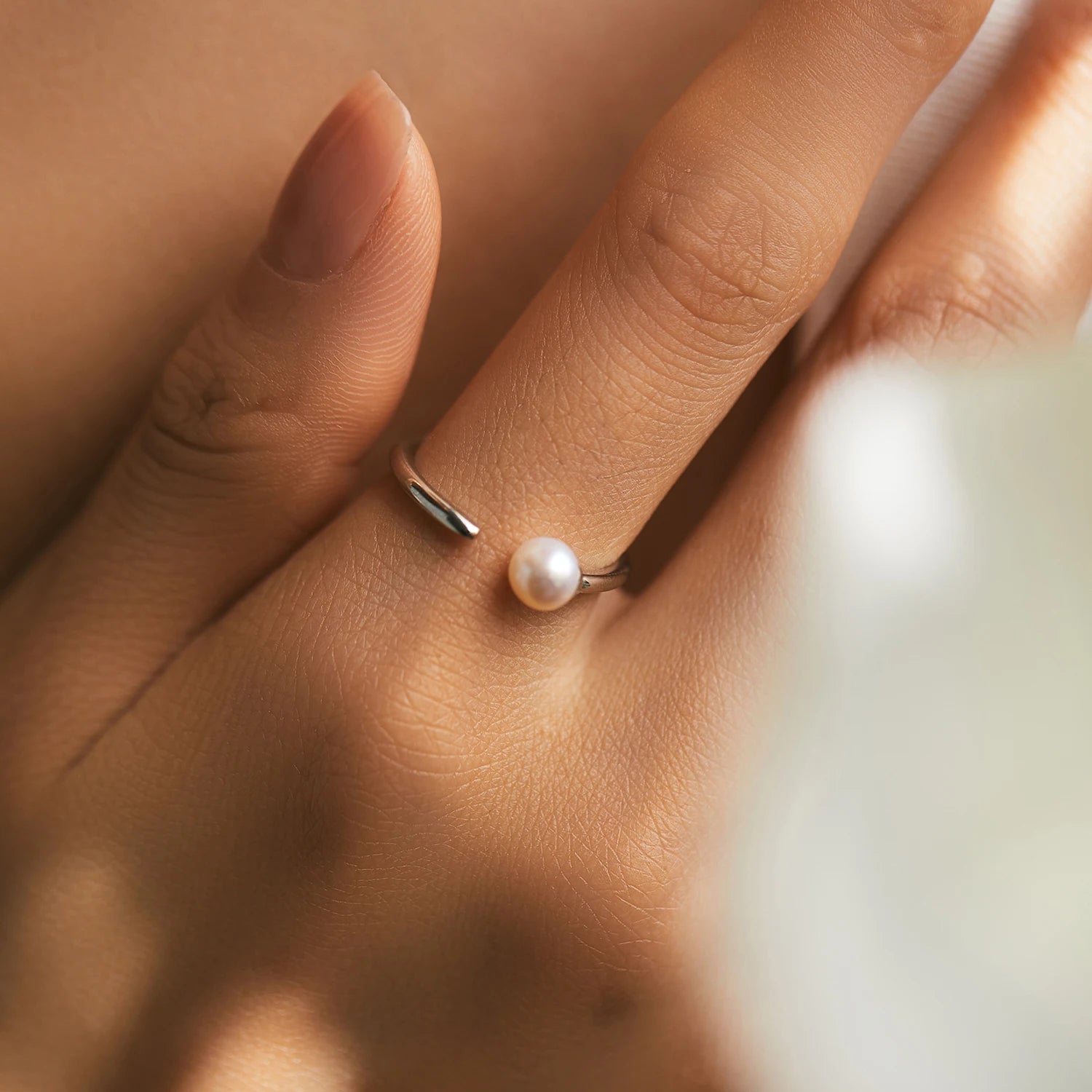 Sterling silver ring showcasing a single freshwater pearl in polished 925 sterling silver
