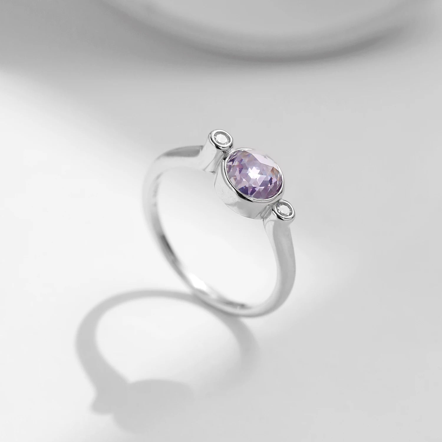 Elegant sterling ring showcasing gem purple on a polished band