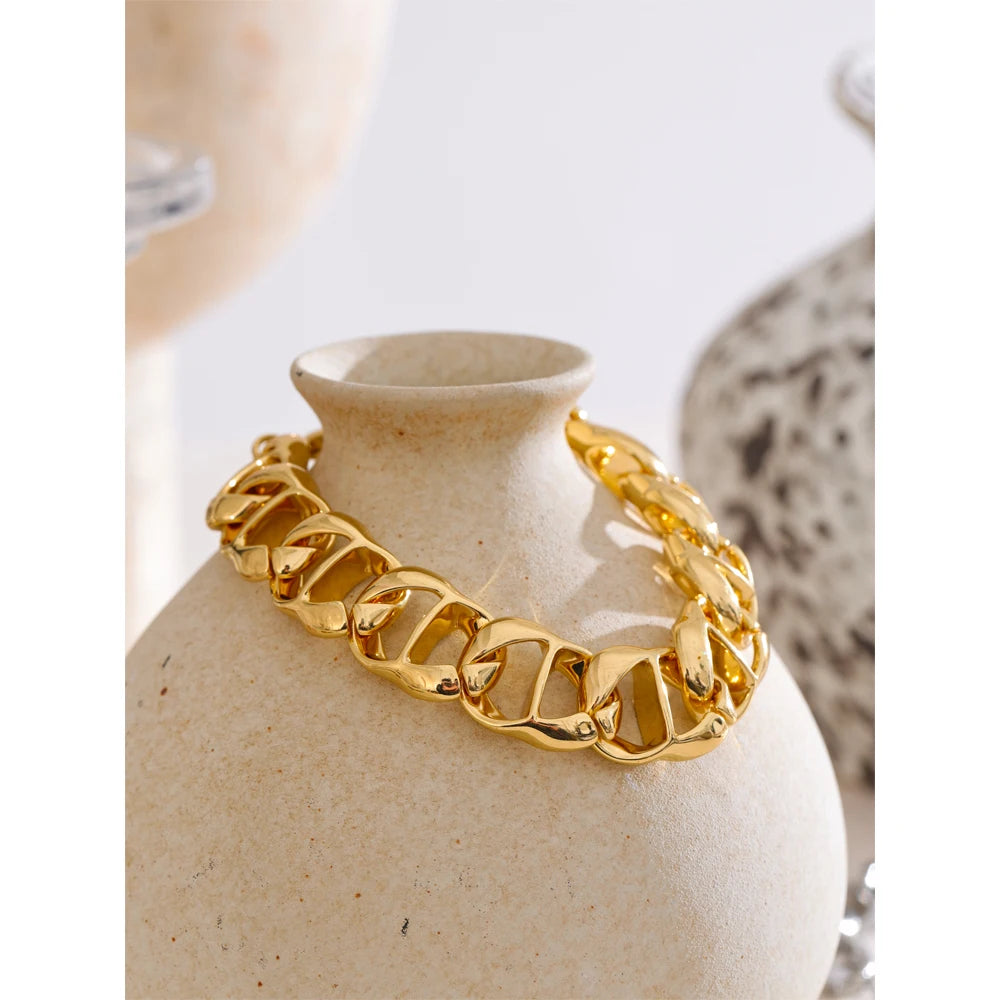 Minimal studio photo of chain links paired with bracelet bracelets