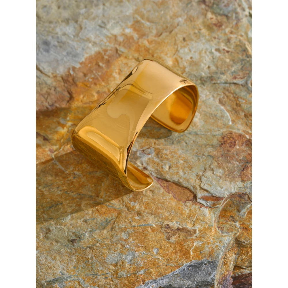 Bracelet with gold radiance styled as a bold cuff bracelet