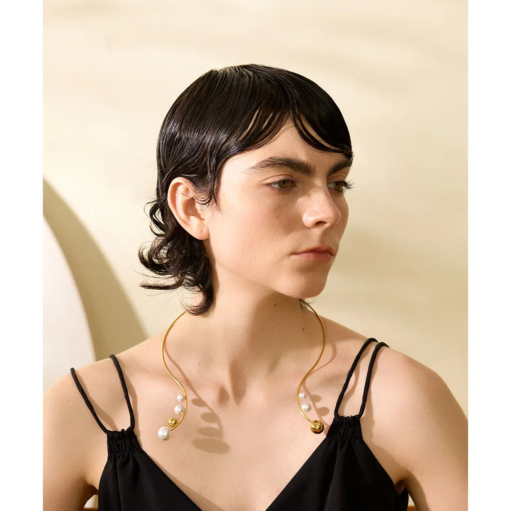 Necklace pearl accented open torque collar style with golden finish