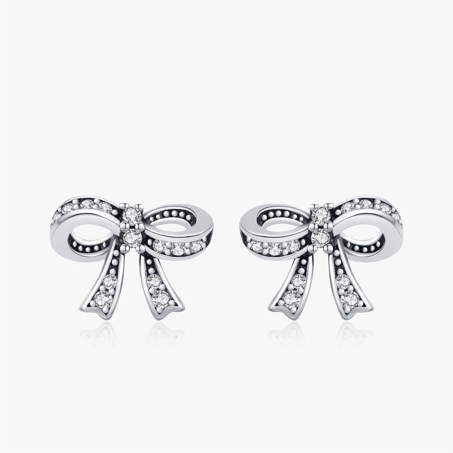 Vintage bowknot CZ stud earrings in 925 sterling silver on white background