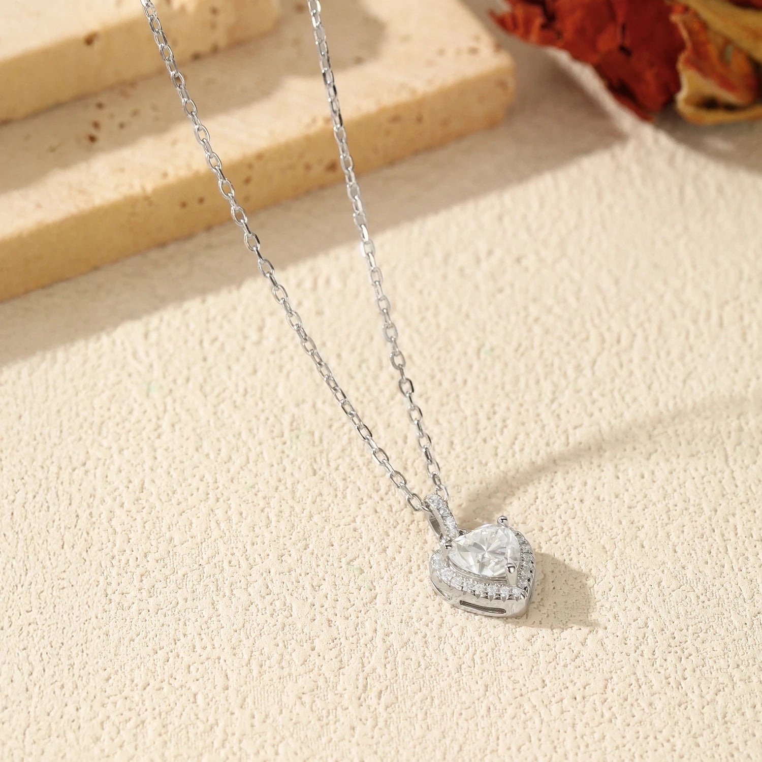 Elegant pendant necklace with radiant heart moissanite stone in halo setting
