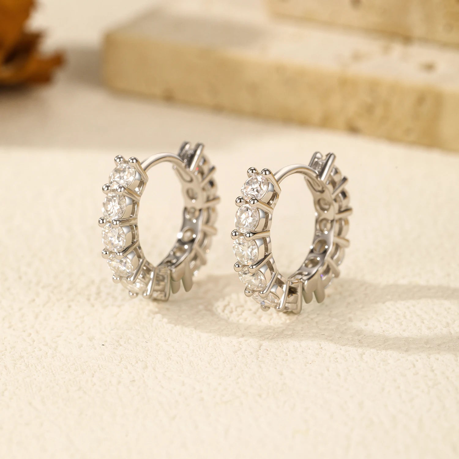 925 silver moissanite earrings arranged with matching jewelry sets