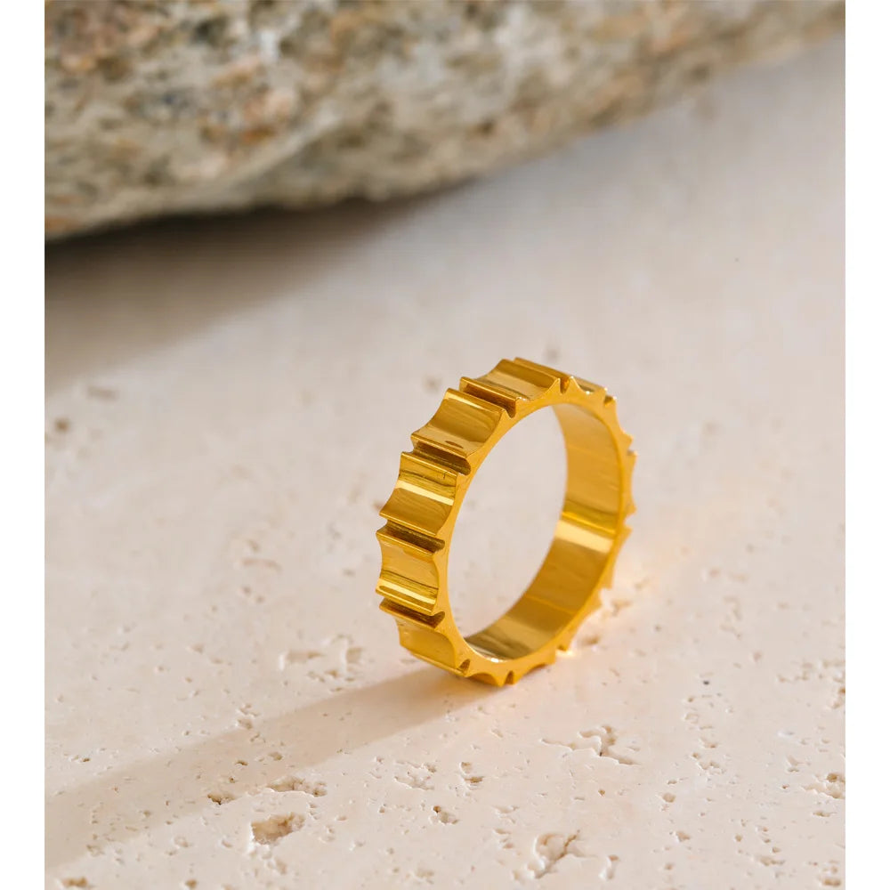 Bold gold ring ring with smooth sculpted metal texture