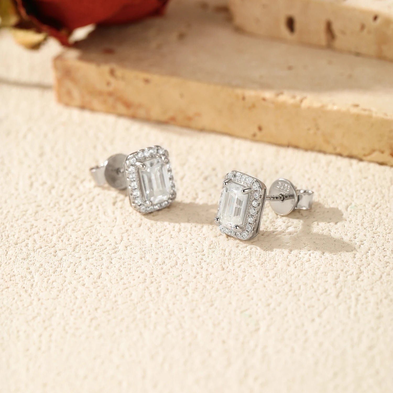 Women’s sterling silver earrings with emerald cut moissanite