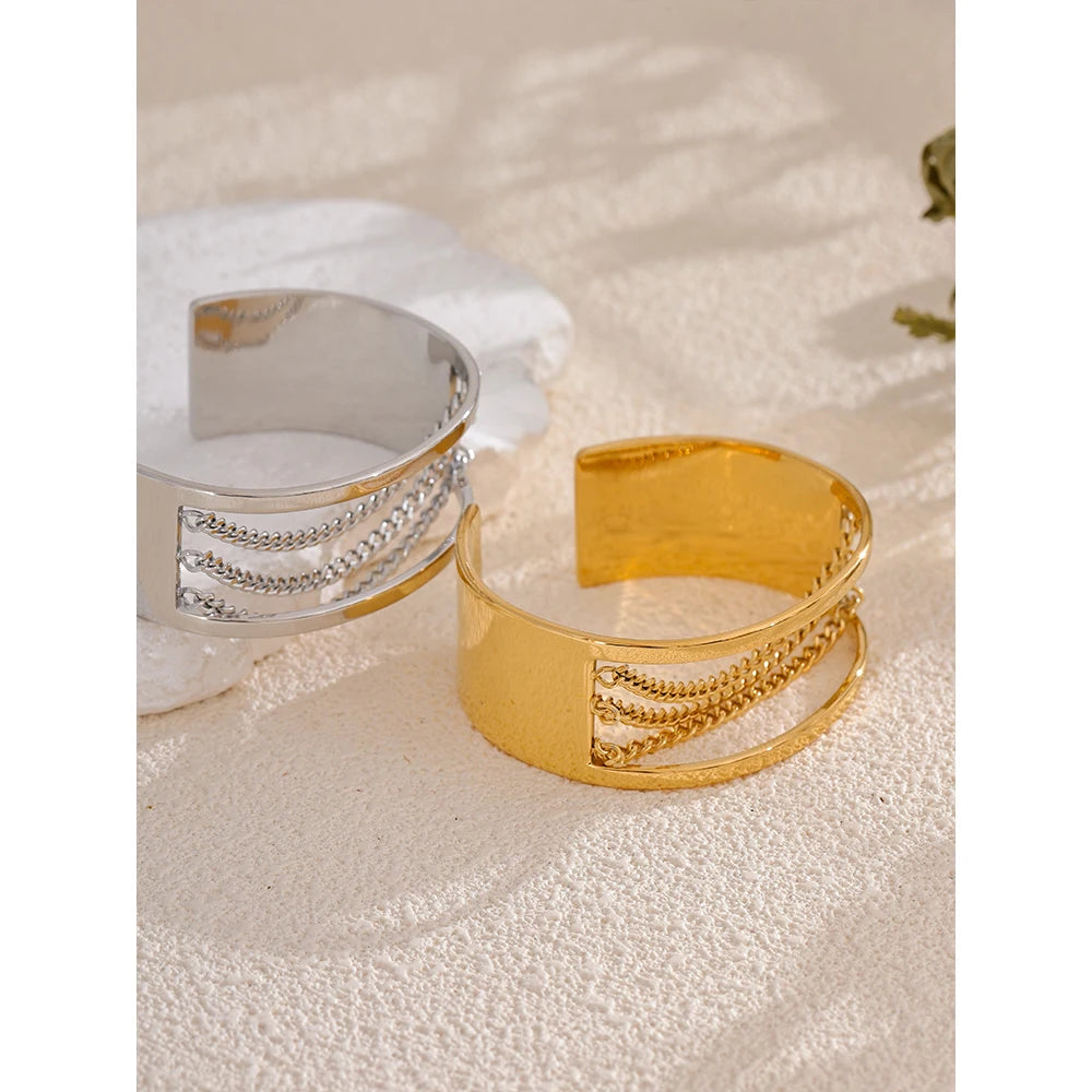 Minimal flat lay of gold chain gold chain piece as a bracelet with chain accent