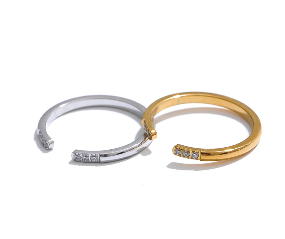 Stacked ring look combining the thin zirconia open ring with other gold rings