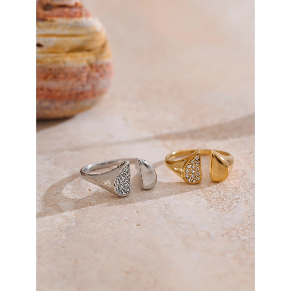 Open ring design showing adjustable finger and ring fit in gold tone