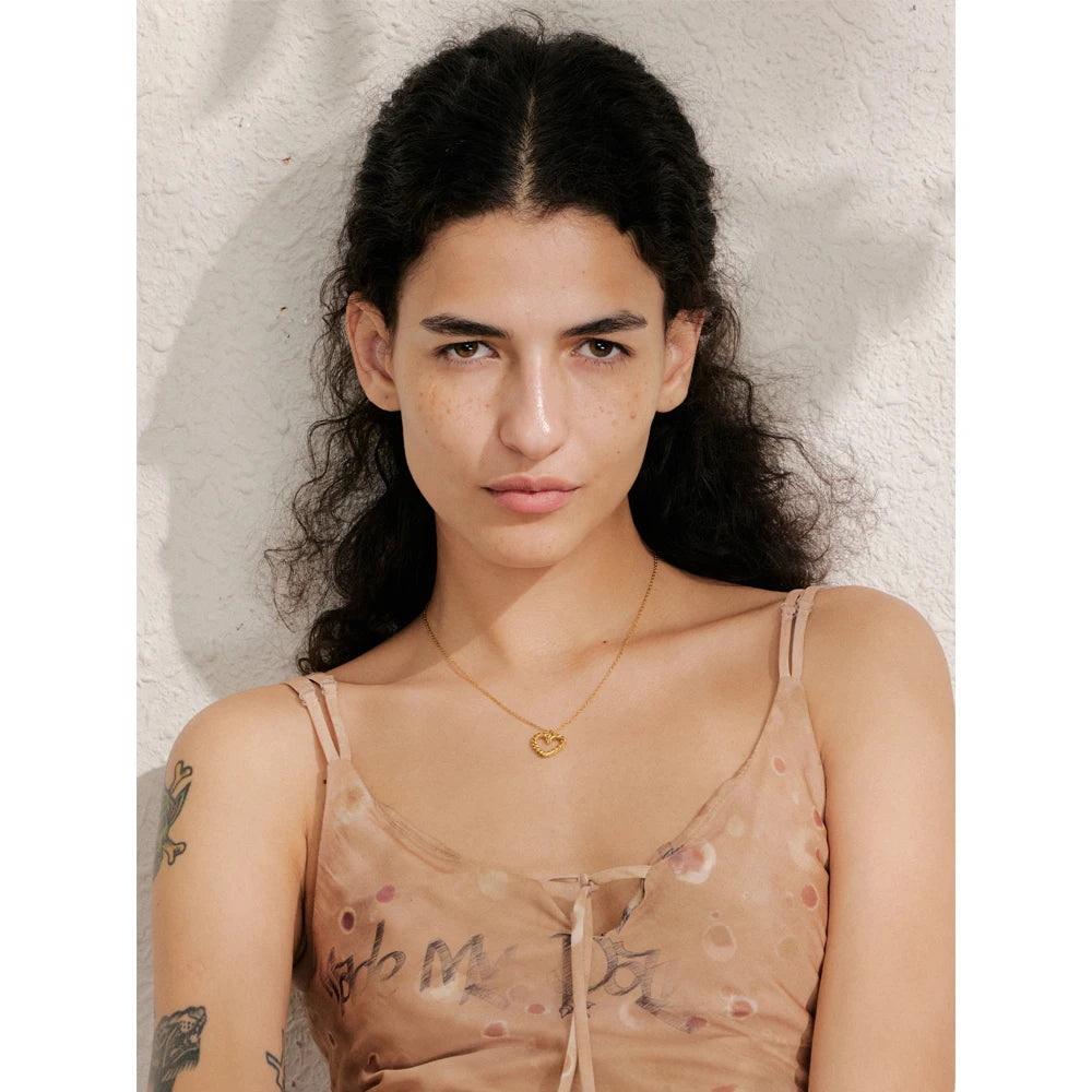 Necklace and pendant pairing styled as necklace and necklace layers