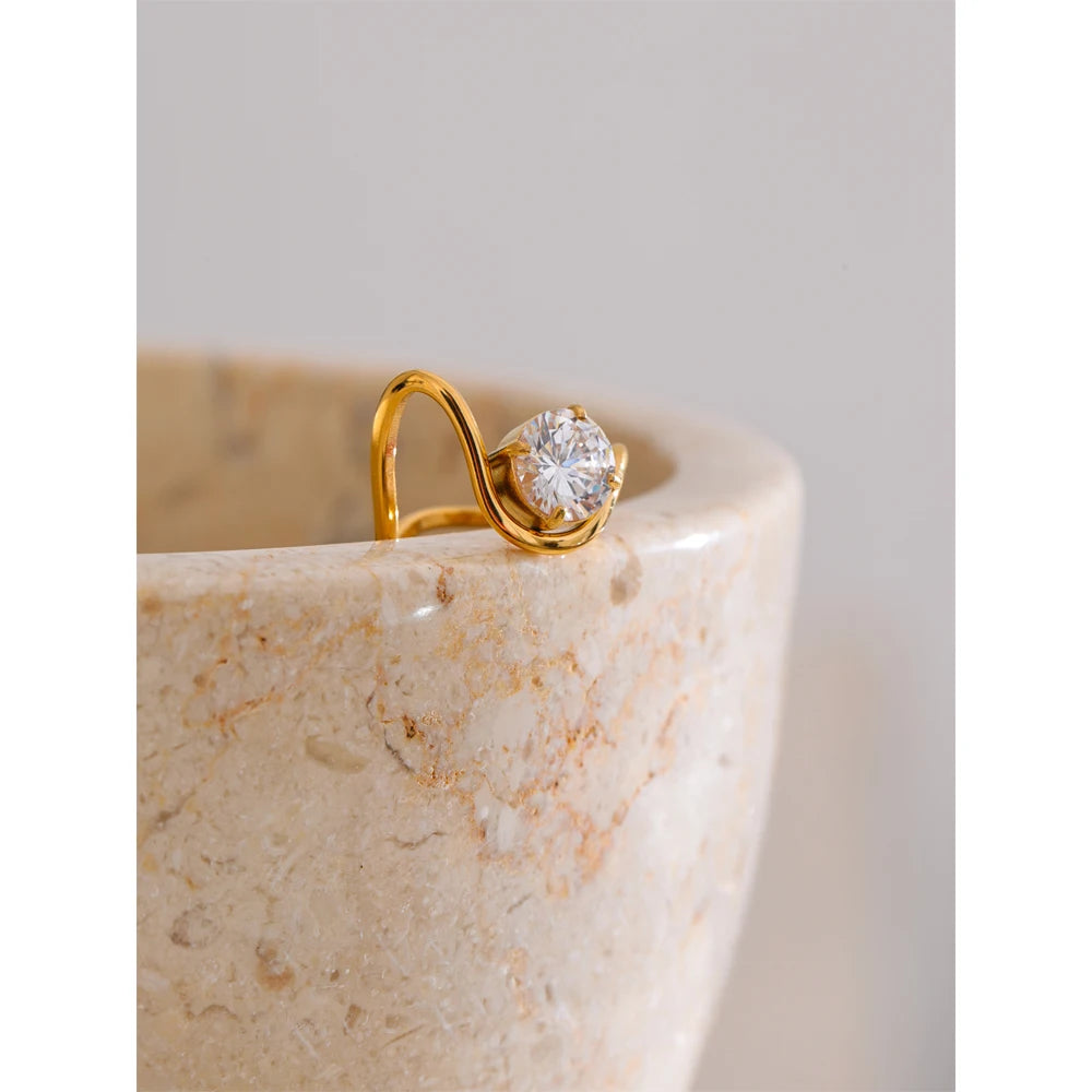 Stackable rings gold rings arrangement featuring the adjustable geometric ring as focal