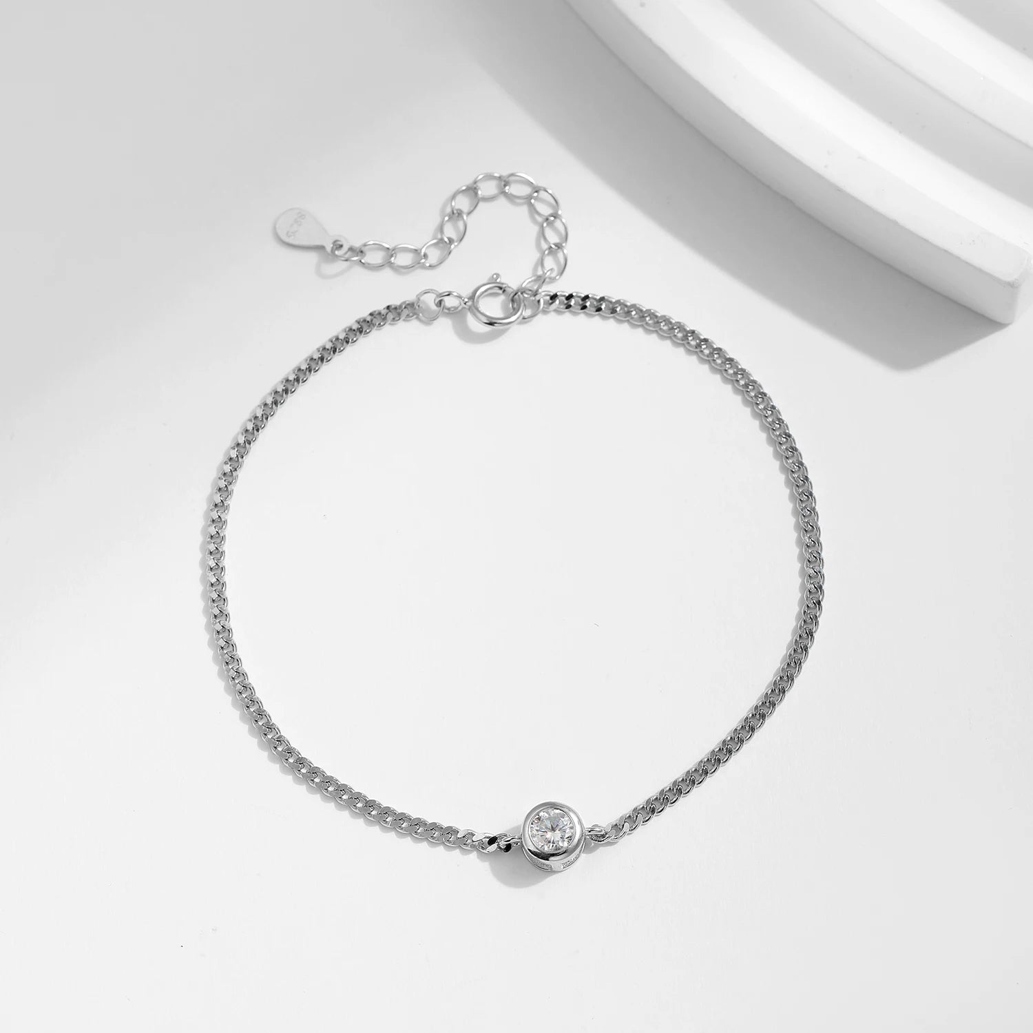Sterling silver bracelet showcasing moissanite diamond bezel sparkle