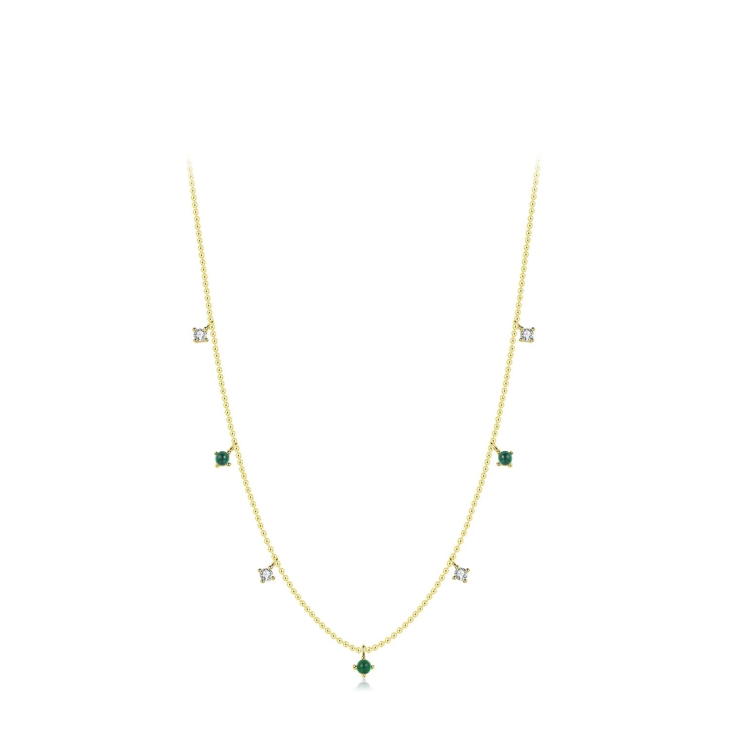 Necklace and necklace stack featuring a subtle charm necklace