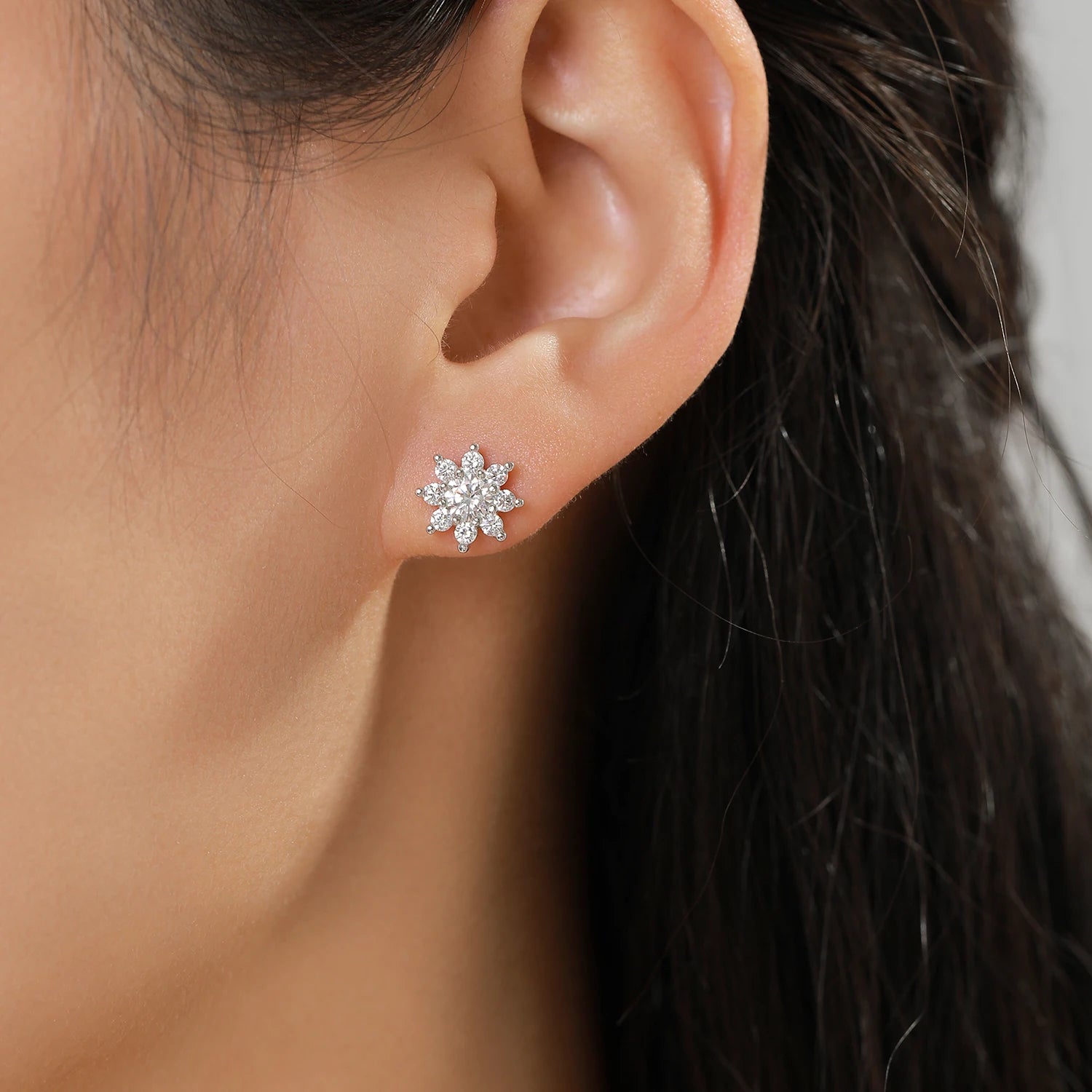 Close view of stud earrings styled as elegant ear rings with bright facets