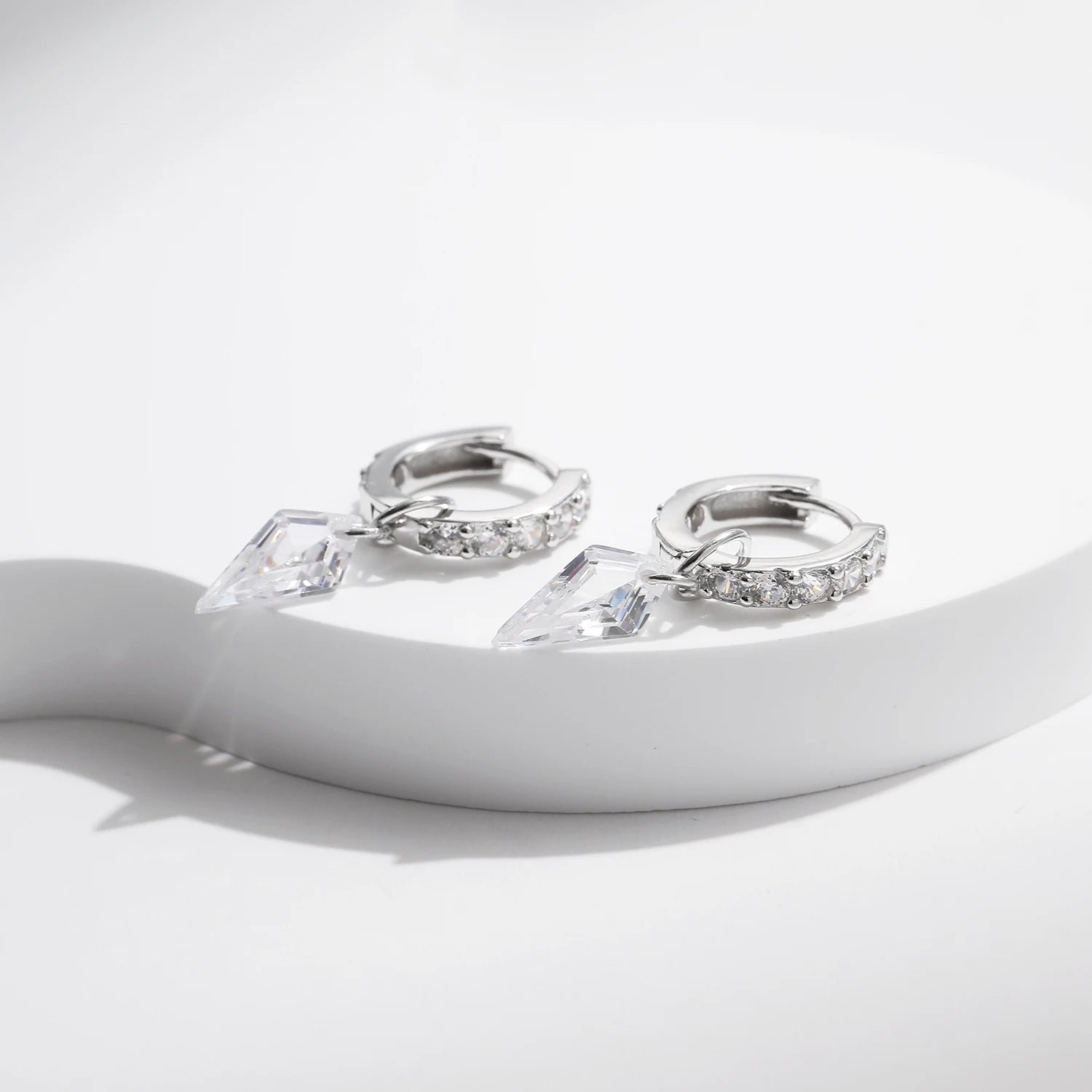 Model wearing hoop earrings for women featuring rhombic silhouette and cz brilliance