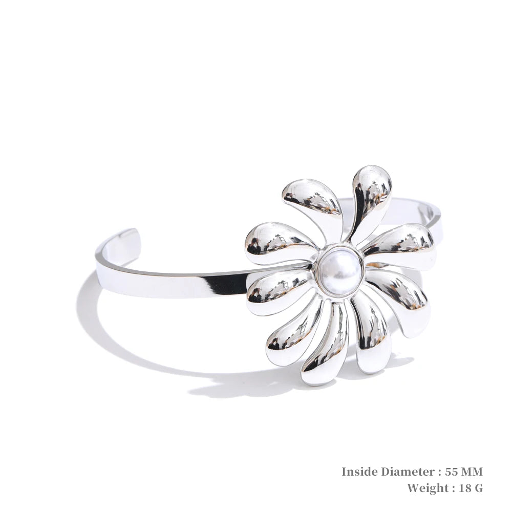 Gold and earrings accents enhancing a flower necklace with classic polish