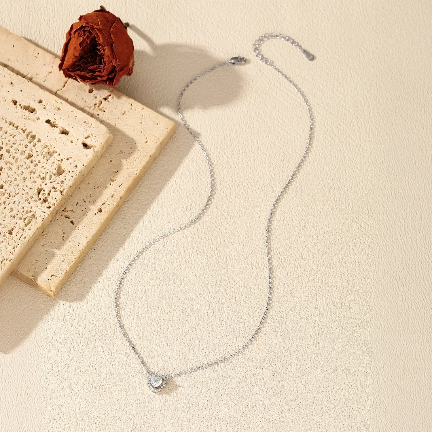 Women’s pendant necklace featuring polished sterling silver chain