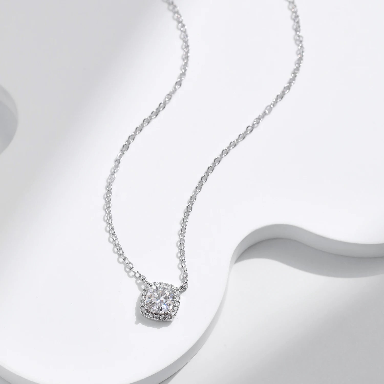 Luxury jewelry look featuring a silver necklace with moissanite chain