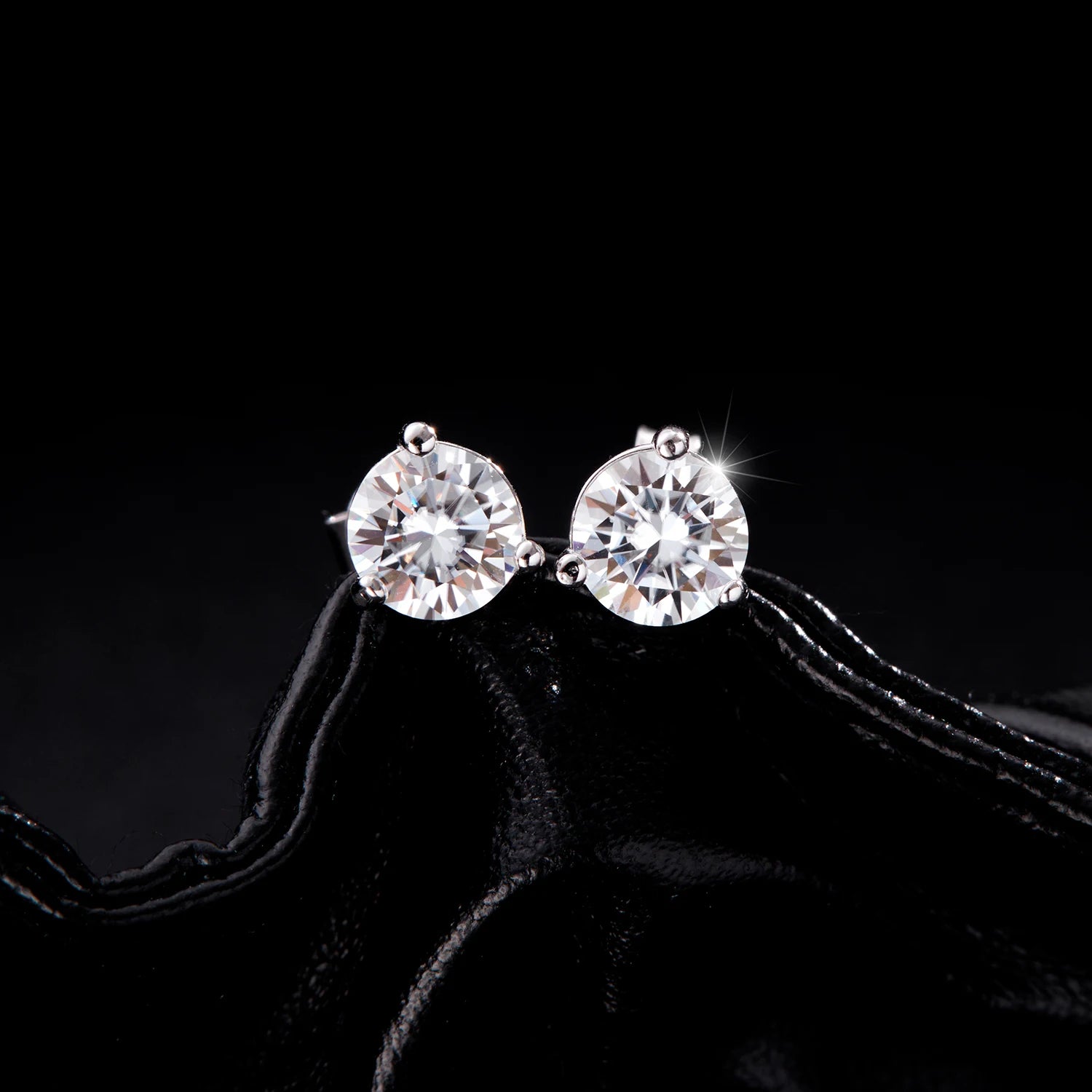 Silver stud earrings showcasing bright moissanite earrings sparkle