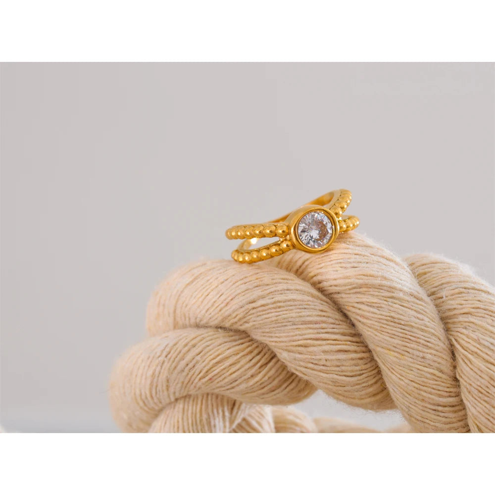 Close view of cubic zirconia on a polished gold ring band