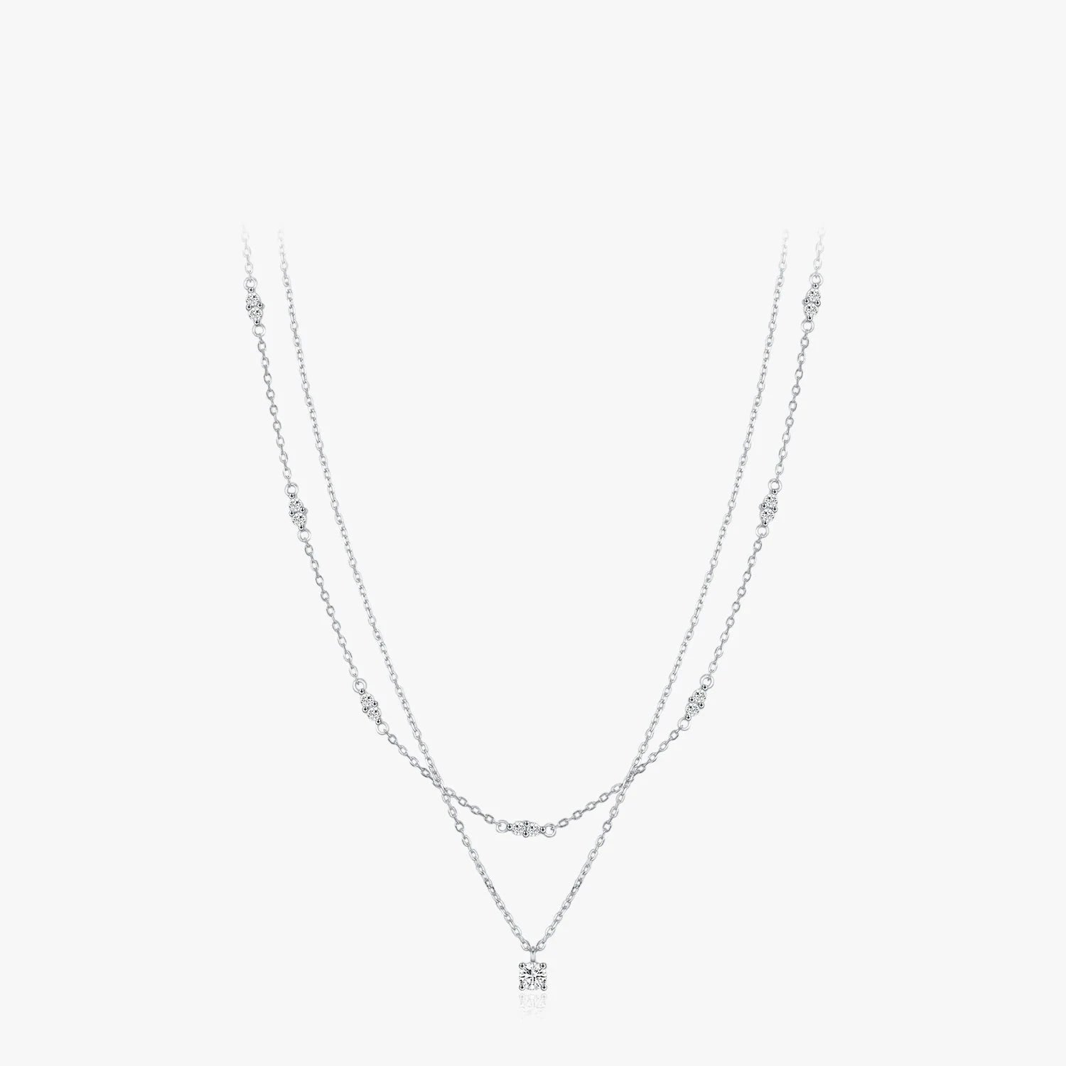Layer necklace style with moissanite jewelry on a polished silver chain
