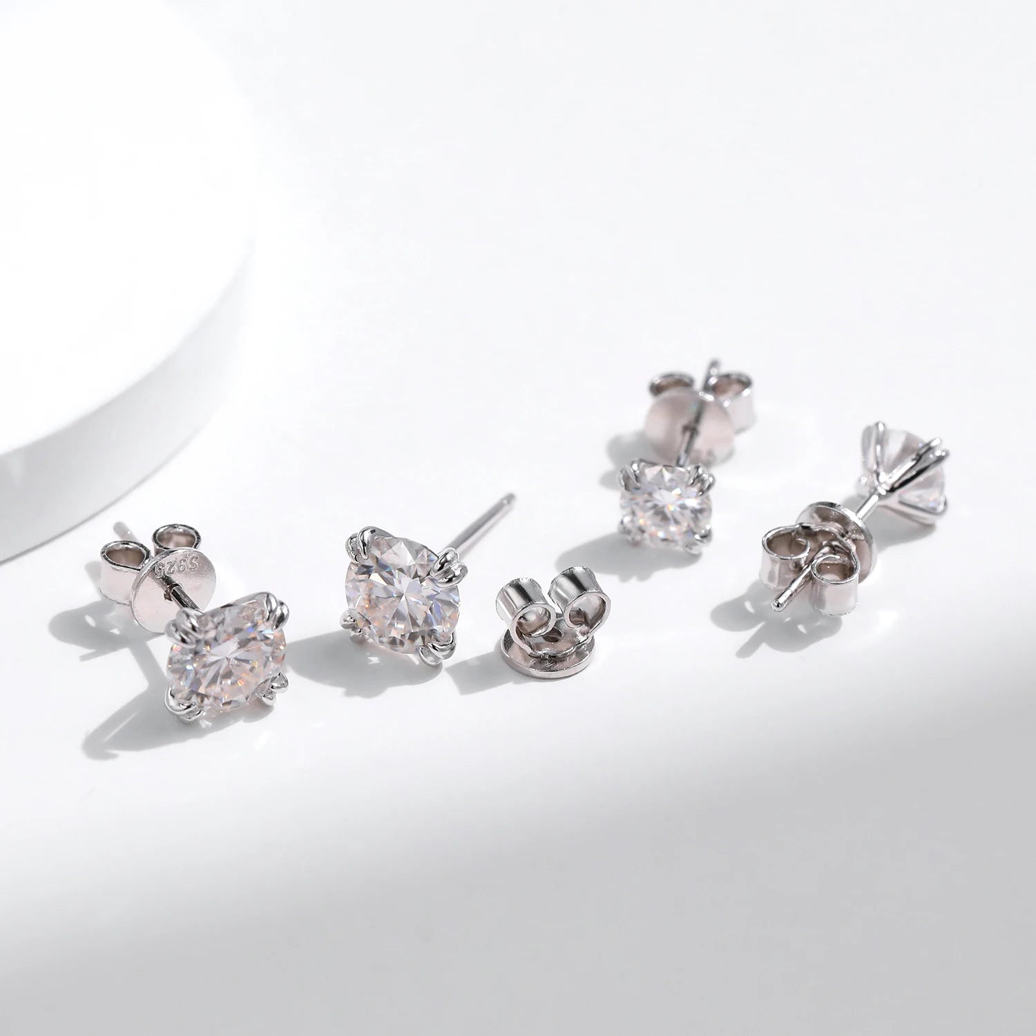 Macro facets of moissanite diamond on classic diamond earrings