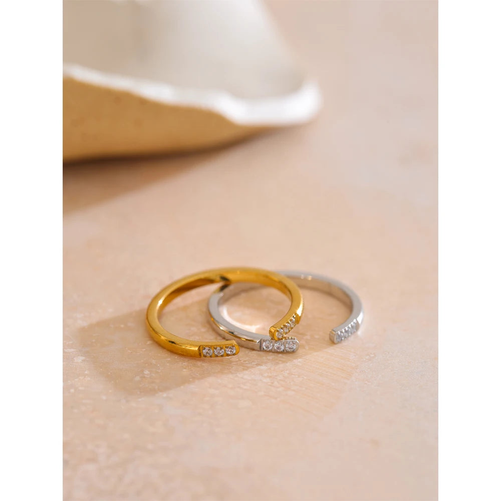 Close-up of open ring showing cubic zirconia detail and dual gold-platinum plated band