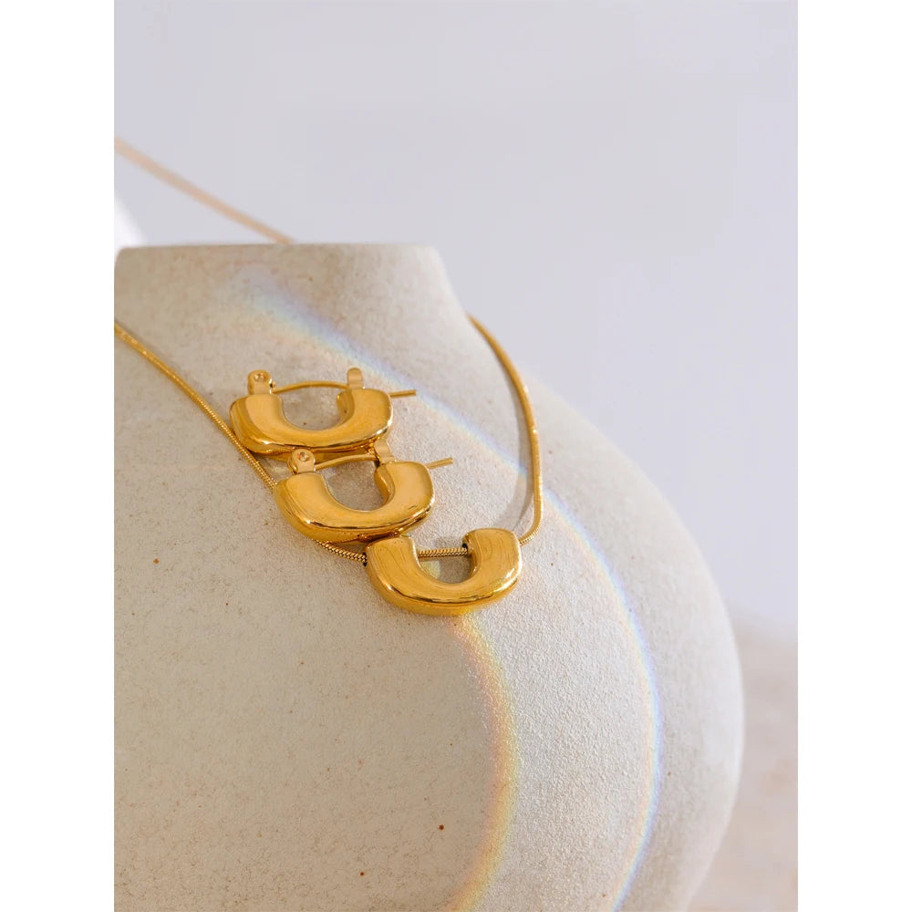 Close view of necklace gold necklace with matching earrings earrings gold