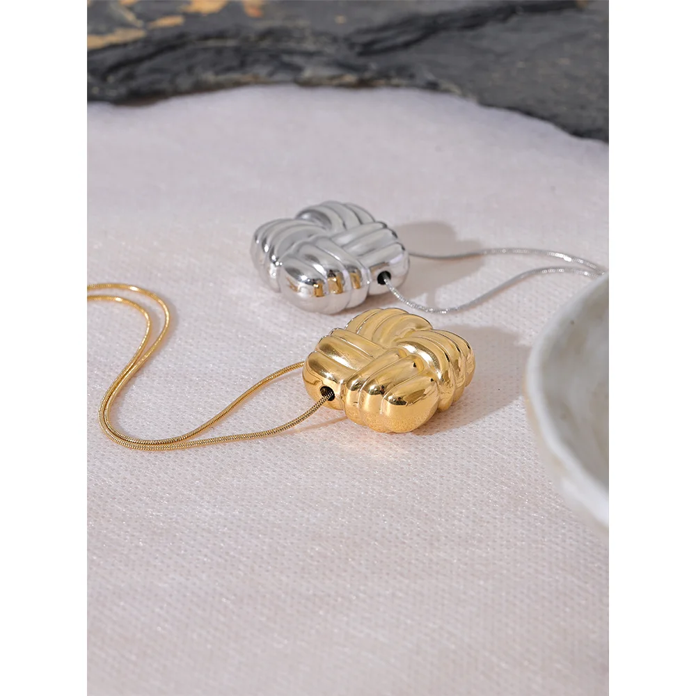 Gold jewelry pendant necklace featuring bold square stripes