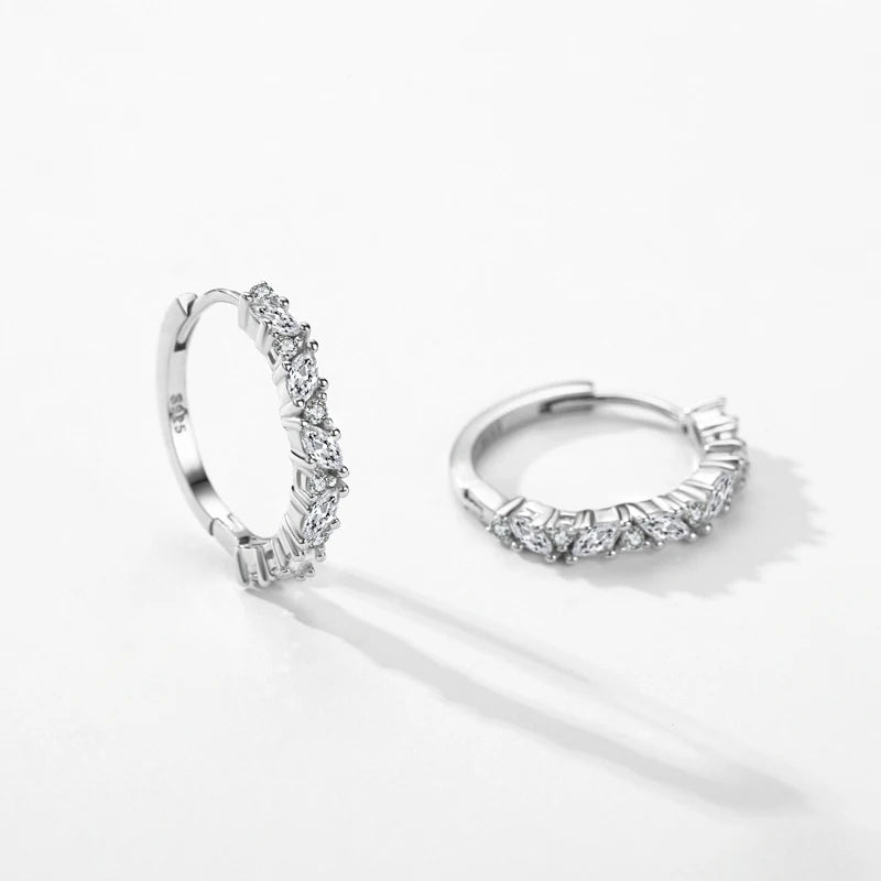 Pair of sterling silver earrings shown as classic hoop earrings