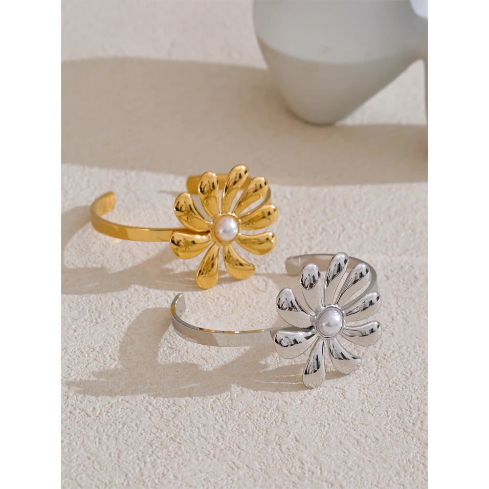 Close up of necklace pearls on a gold and earrings ensemble with floral detail