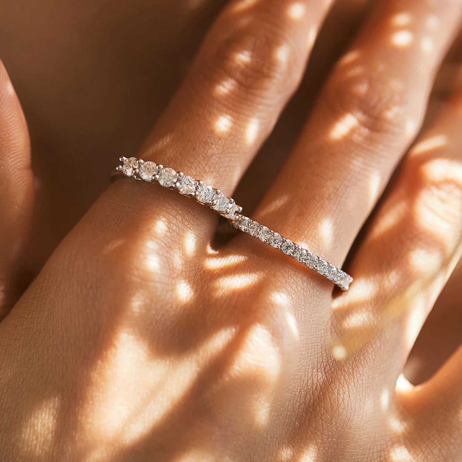A wedding ring shown beside a matching wedding band for a timeless pair