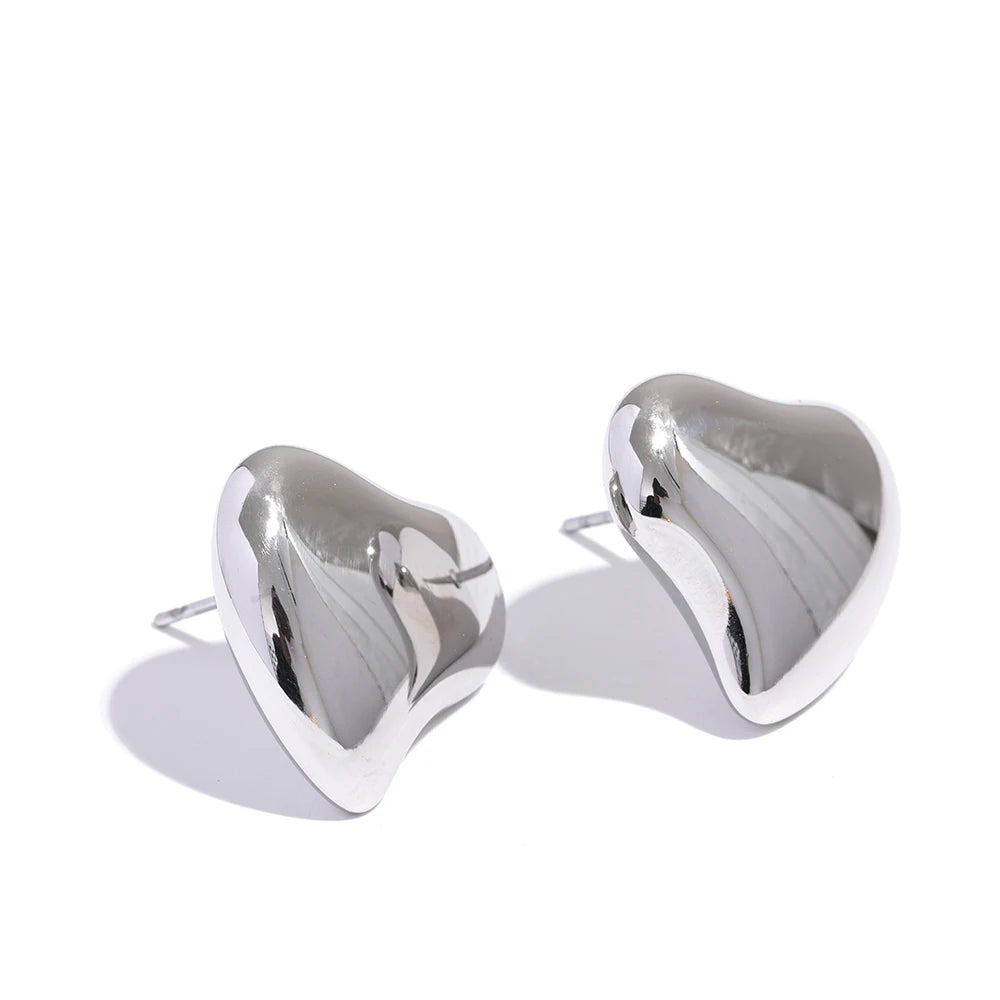 Pair of gold jewelry heart earrings