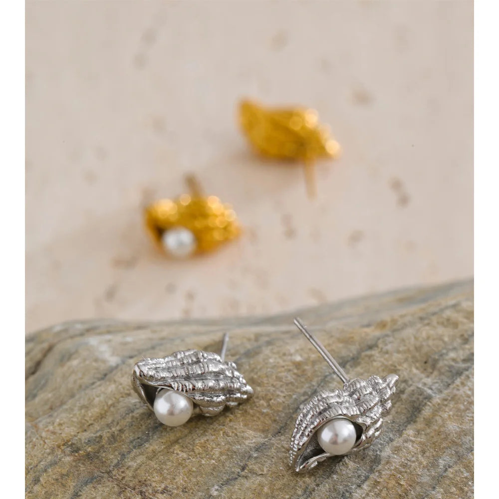 Close up of pearl earrings crafted in stainless steel jewelry