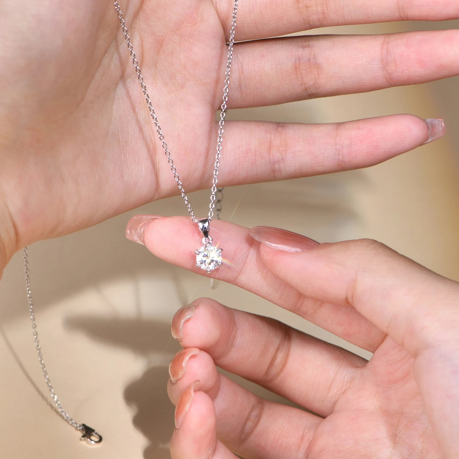 Elegant silver necklace featuring a 1 carat diamond style center