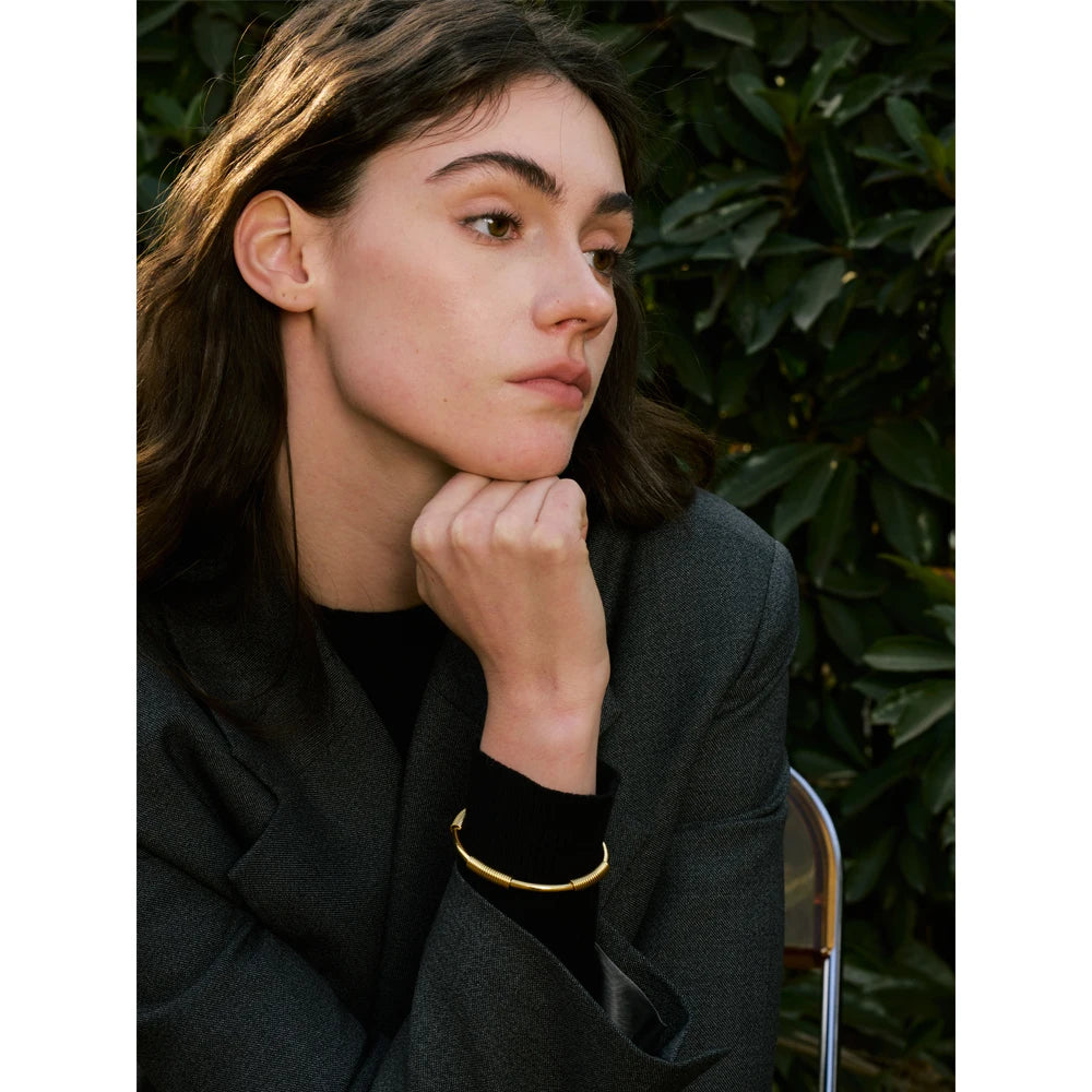 Wrist view of 57mm round cuff worn as a gold bracelet bracelet hero piece