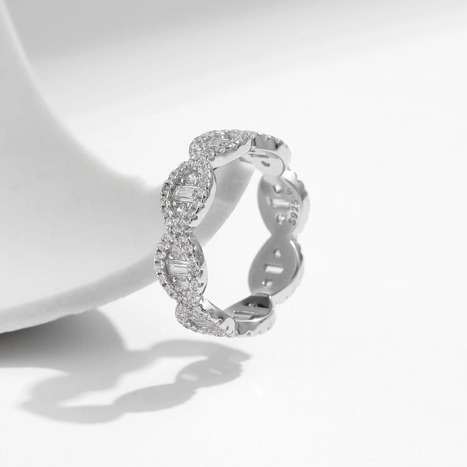 Clear CZ eternity band styled among cz rings for elegant stacking