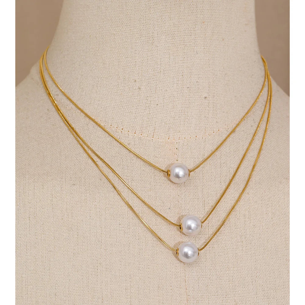 Necklace pearl necklace style featuring layered pearl chains