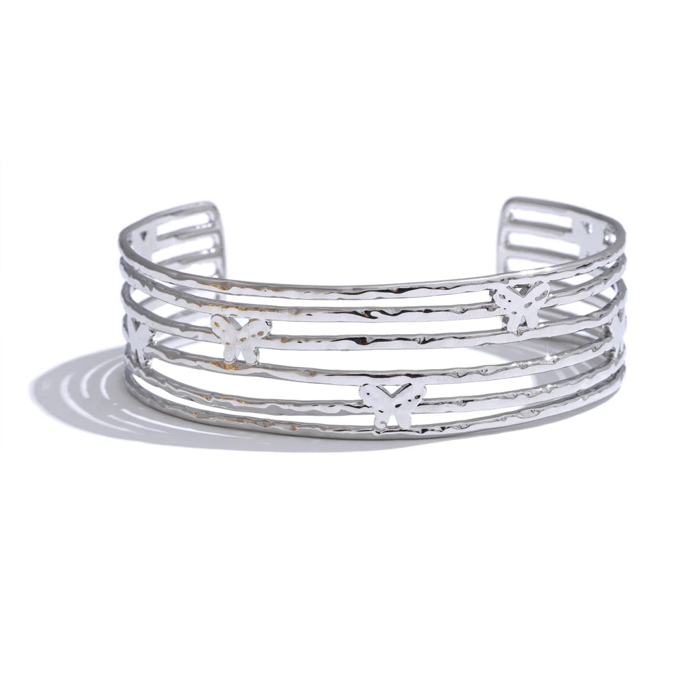 Gold bracelet bracelet stack featuring a cuff bracelet in gold