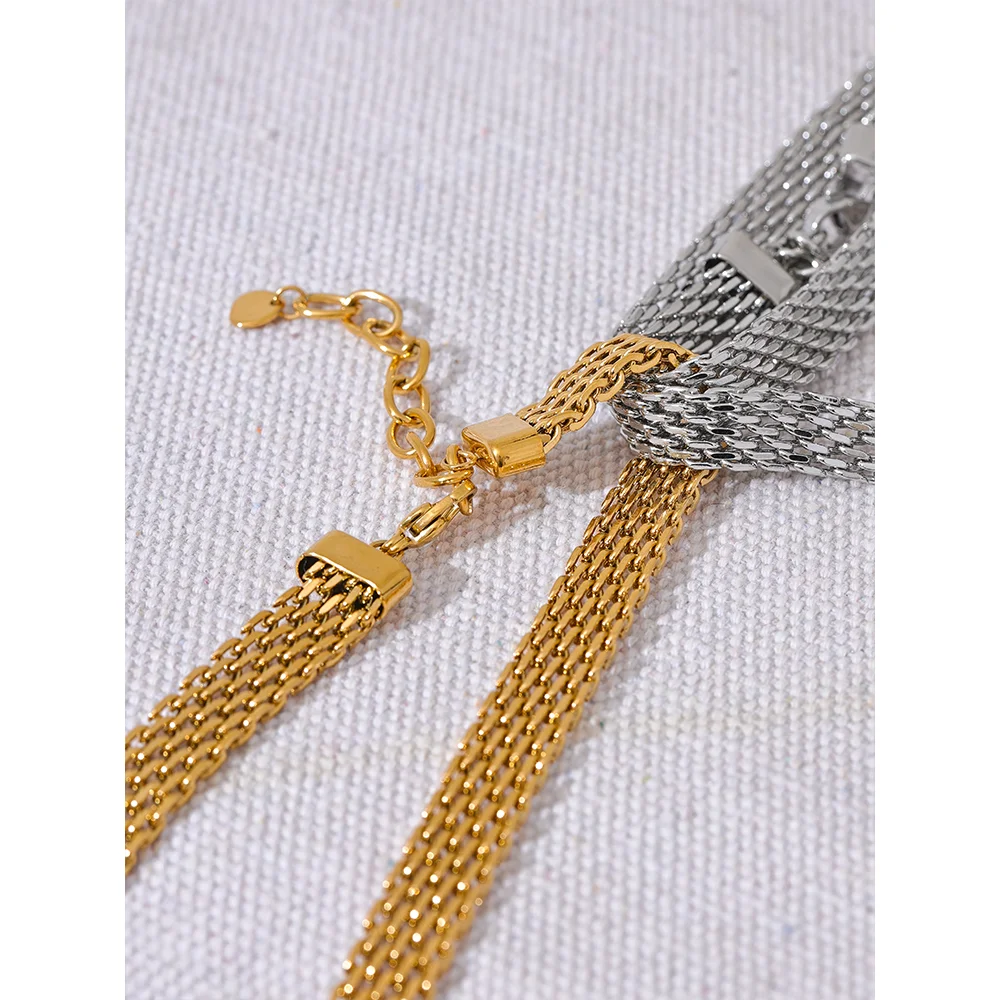 Gold and chain pairing featuring a bold gold bracelet