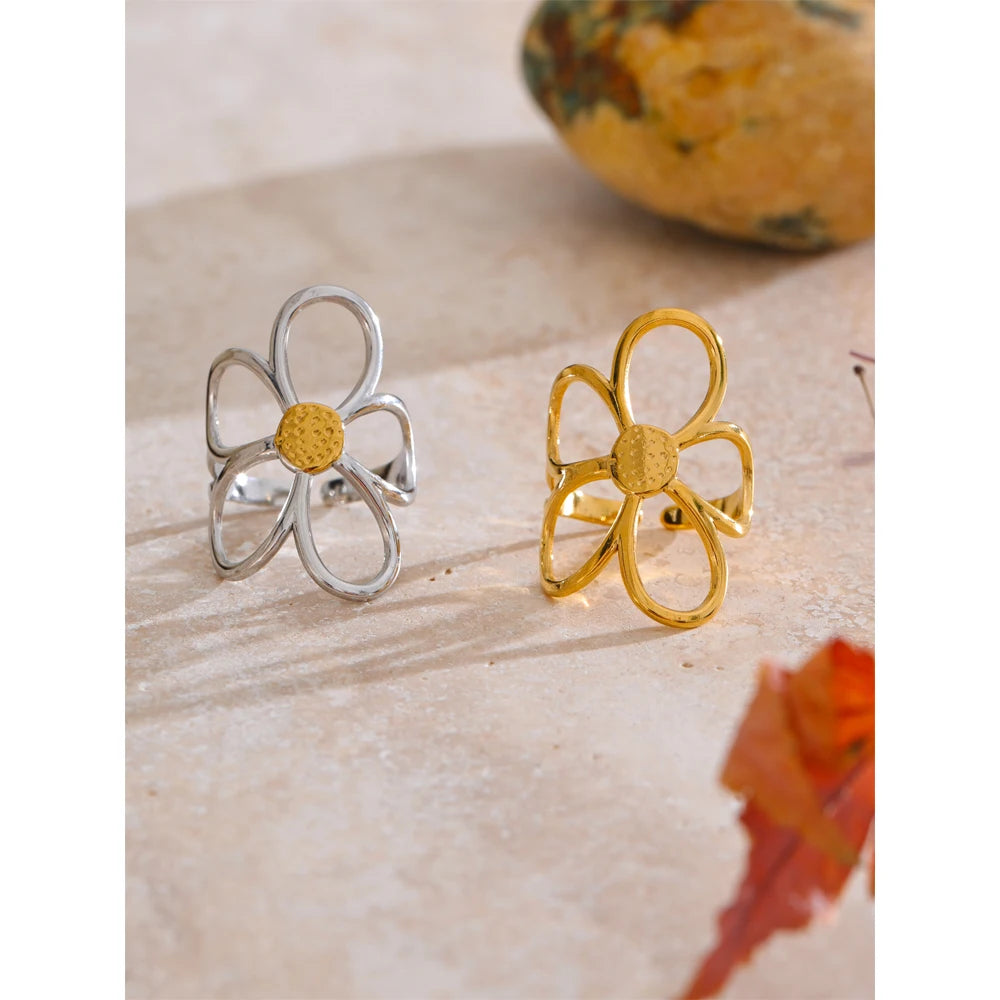 Minimal finger and ring accessory featuring flower ring and gold plated steel
