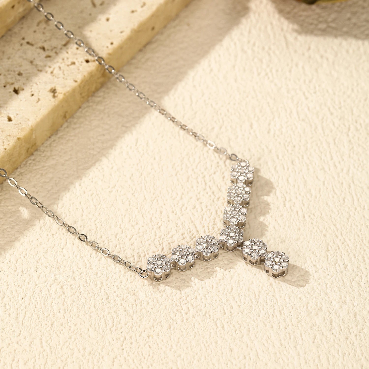 Necklace and pendant styling with charm necklace accent