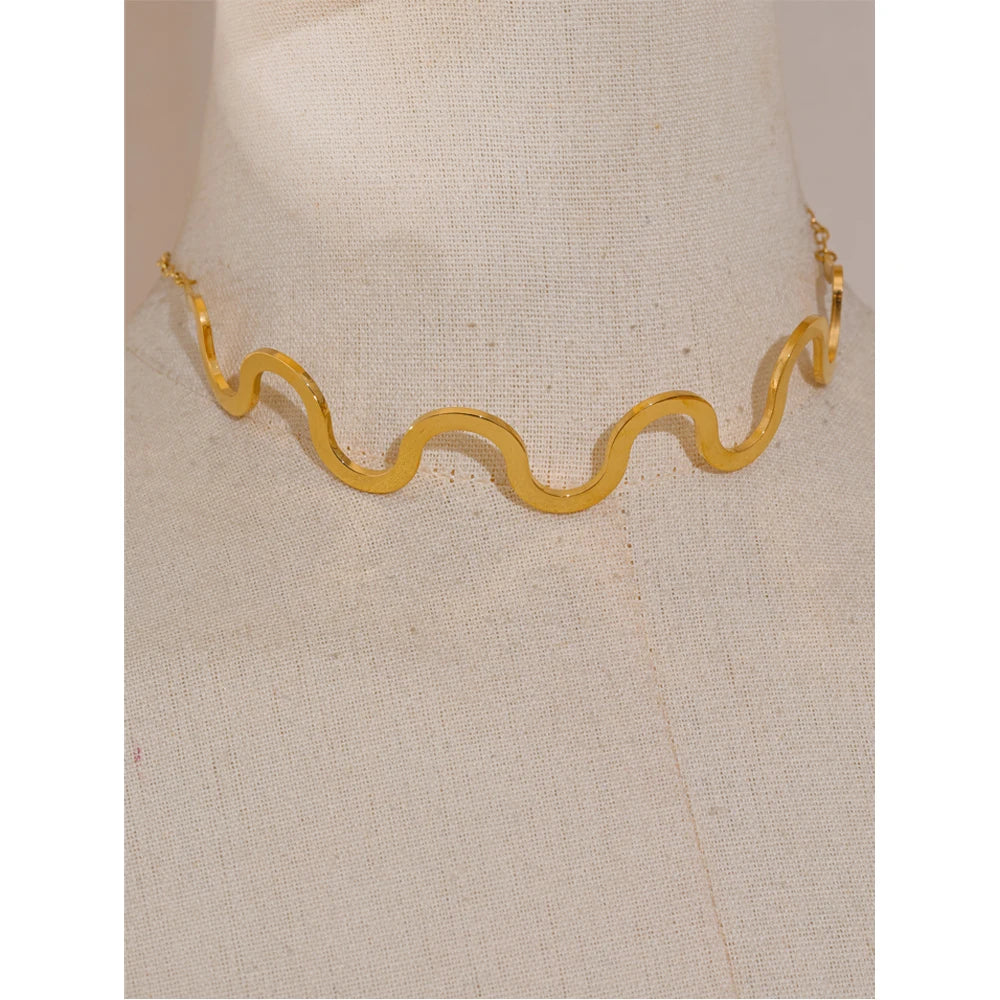 Close up of wave pattern gold plated choker necklace