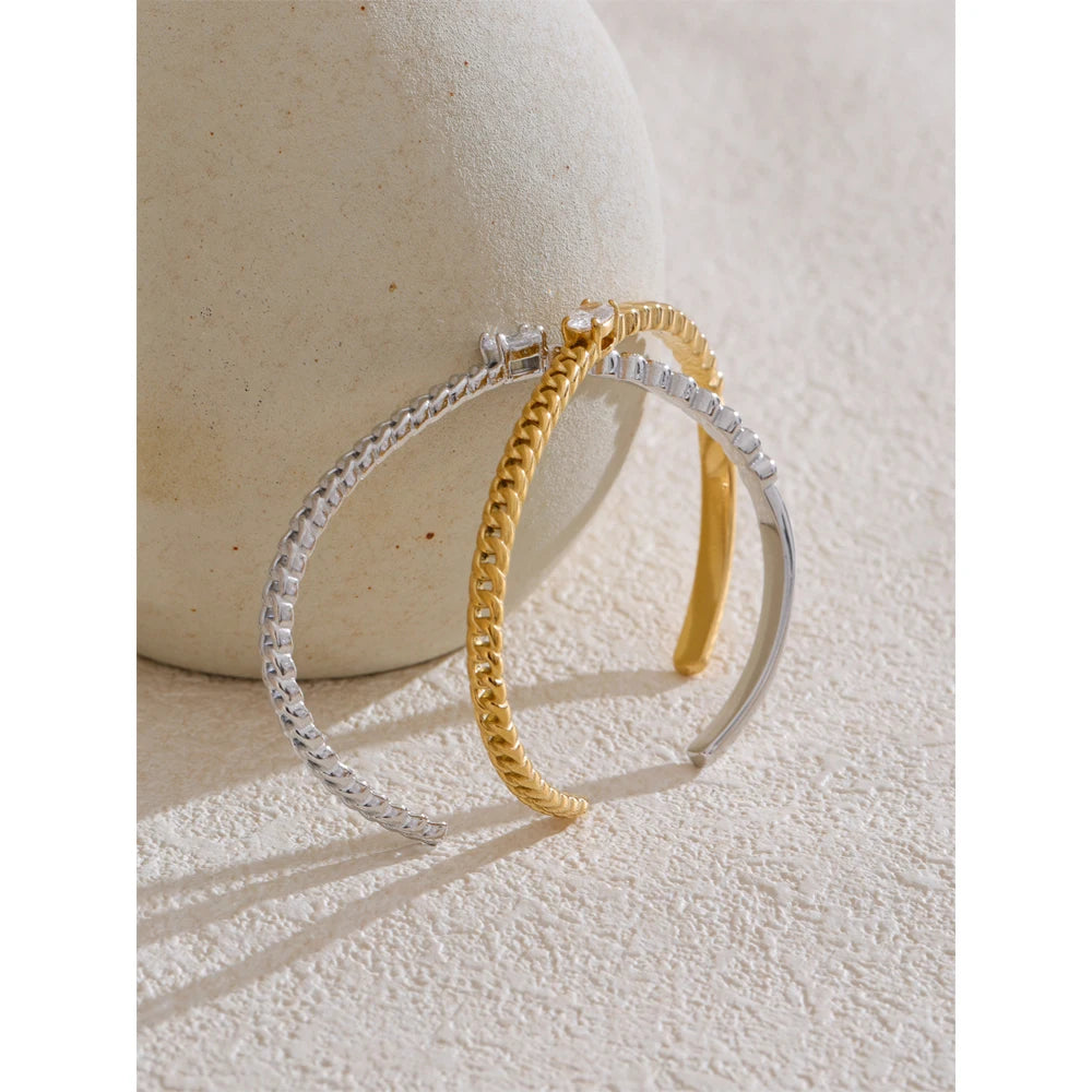A gold bracelet design accented by zircon with smooth bracelet chain flow