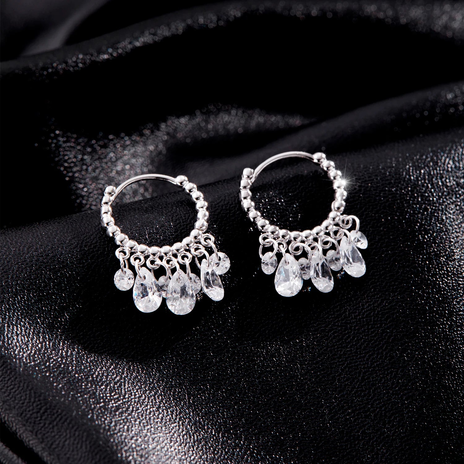 Pair of silver hoop earrings showing geometric design and silver color finish