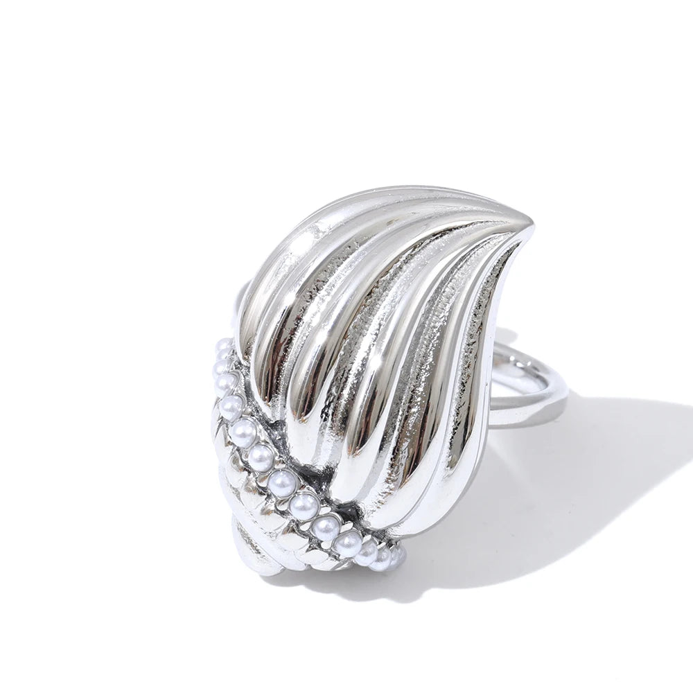 Fashion portrait wearing a charm necklace layered over a necklace and necklace stack