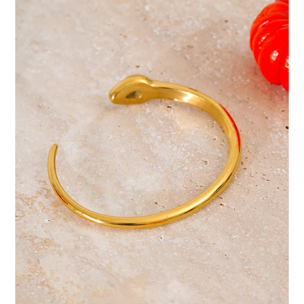 Stylish gold cuff with smooth curved snake design