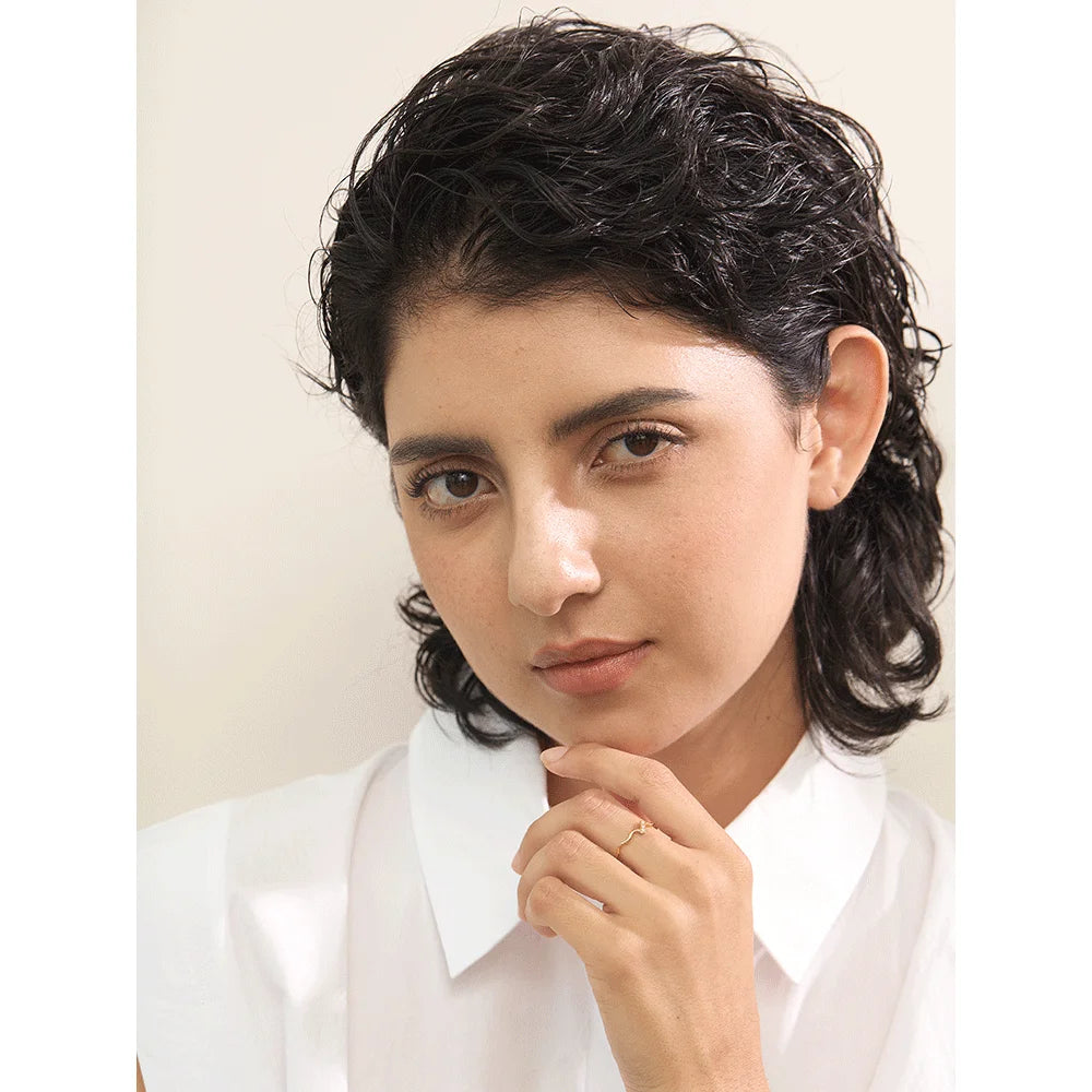 Close-up of slender stainless steel ring with sparkling CZ stones